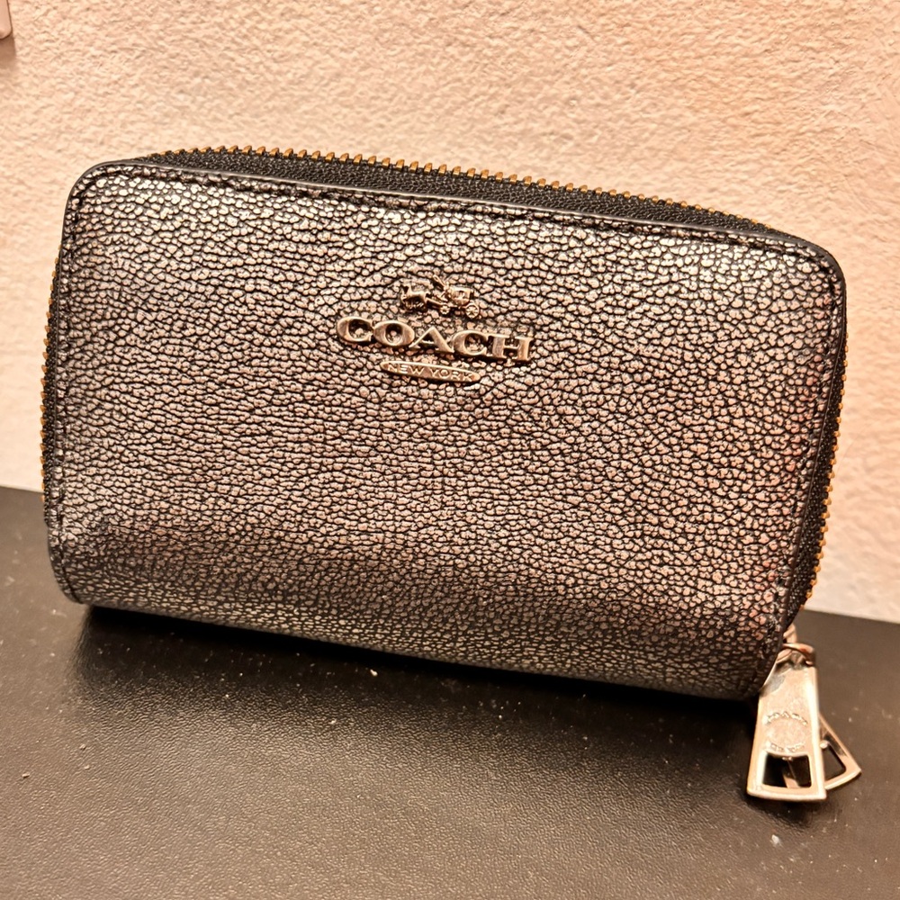 Coach file style card case. Pewter w/2 zippers. Used, good condition.